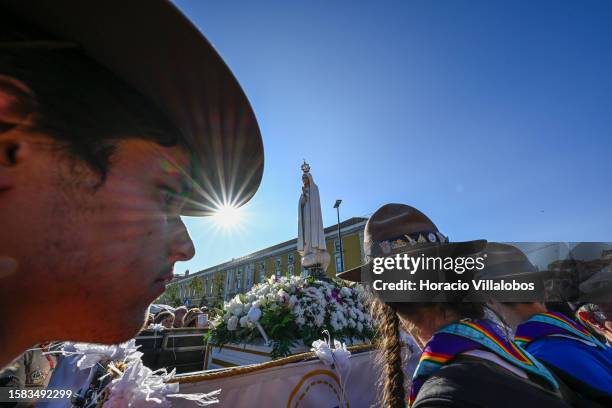 The Pilgrim Image of Our Lady of Fatima sits atop of a truck escorted Boy Scouts after having sailed the Tagus River onboard a traditional barge into...