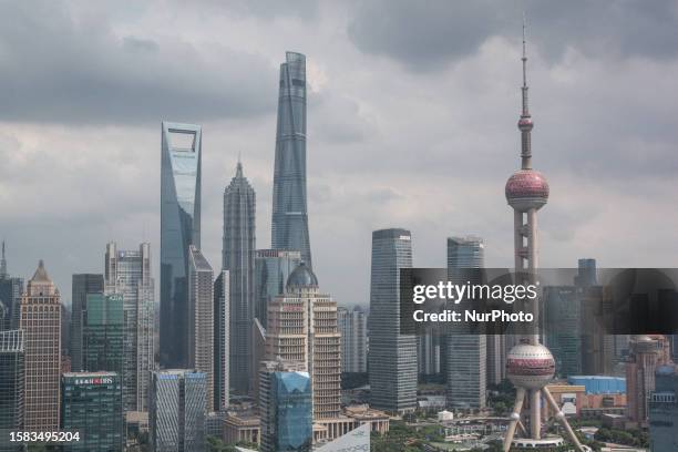 General top view of the skyline from Lujiazui and the Huangpu River in Shanghai, China is being captured on August 7, 2023 .