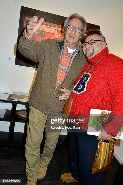 Long Chris and a friend attend the 'Amerique: Instantanes' - Laurent Hubert Painting Exhibition Preview at Galerie Myriane on December 13, 2012 in...