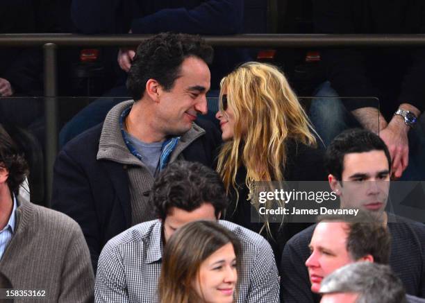 Olivier Sarkozy and Mary-Kate Olsen attend the Los Angeles Lakers vs New York Knicks game at Madison Square Garden on December 13, 2012 in New York...