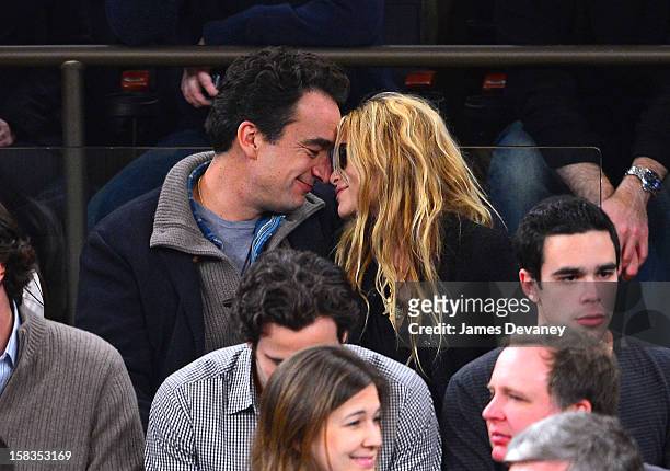 Olivier Sarkozy and Mary-Kate Olsen attend the Los Angeles Lakers vs New York Knicks game at Madison Square Garden on December 13, 2012 in New York...