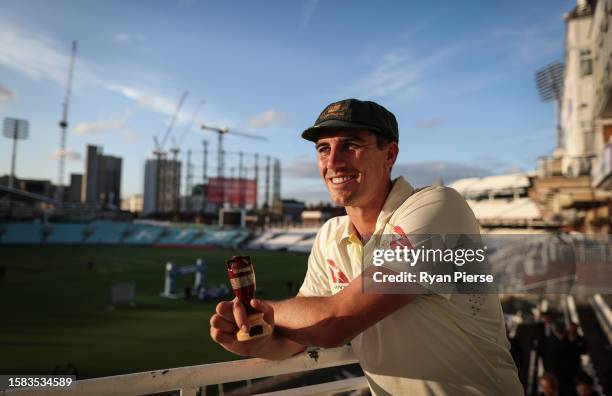 Pat Cummins of Australia poses with a replica Ashes Urn after Day Five of the LV= Insurance Ashes 5th Test match between England and Australia at The...