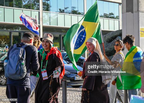 Foreign pilgrims arrive in Cais do Sodre after the Pilgrim Image of Our Lady of Fatima sailed the Tagus River onboard a traditional barge into...