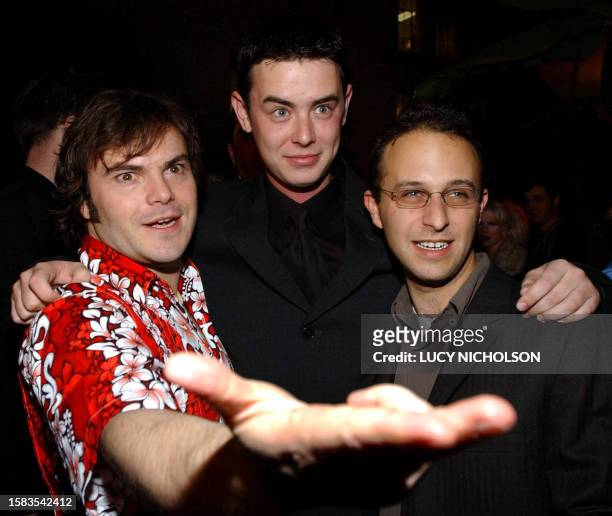 Actor Colin Hanks , son of actor Tom Hanks, poses with co-star Jack Black and director Jake Kasdan at the premiere of their new film "Orange County,"...