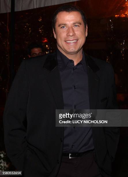 Actor John Travolta arrives at the premiere of his new film "Domestic Disturbance," in Hollywood, 30 October 2001. AFP PHOTO/Lucy NICHOLSON