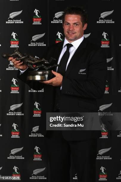 All Black Captain Richie McCaw poses with the Kelvin R Tremain Memorial Player of the Year award during the 2012 Steinlager Rugby Awards at SkyCity...