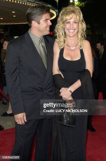 Erin Brockovich arrives at the premiere of the new film "Erin Brockovich," which is based on the true story of her legal fight, with her husband Eric...