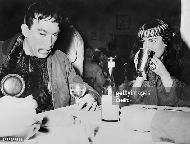 American actor Anthony Quinn take a rest with French actress Colette Regis during the shooting of "Attila" in 1954. Born to an Irish father and...