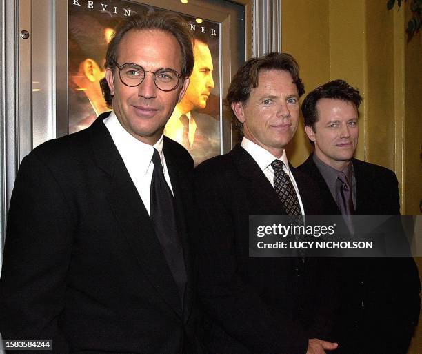 Actor Kevin Costner poses at the premiere of his new film "Thirteen Days" about the 1962 Cuban missile crisis with actors Steven Culp who portrays...