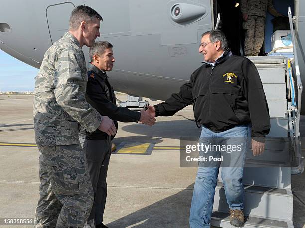 Defense Secretary Leon Panetta greets 10th Tanker Base Commander Brig. Gen Serdar Gulbas and Col. Christopher E. Craige Commander of the 39th Air...