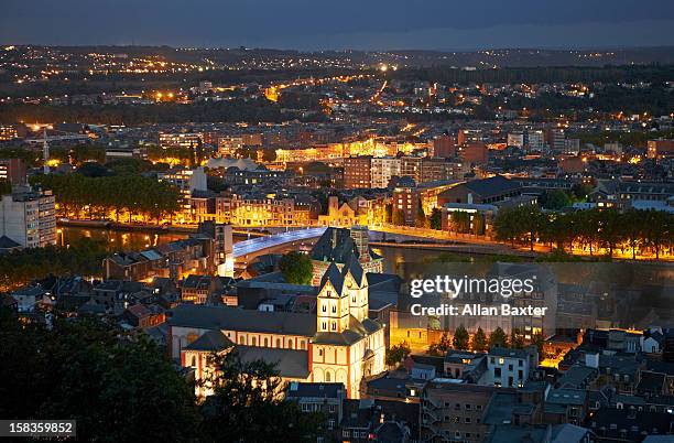 skyline of liege at night - luik stock pictures, royalty-free photos & images