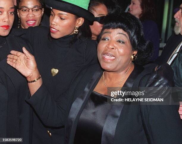 This 16 November 1992 photo shows Dr. Betty Shabazz , widow of civil rights leader Malcom X, arriving with three of her daughters at the world...