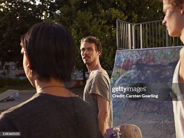 skater - boy looking over shoulder stock pictures, royalty-free photos & images