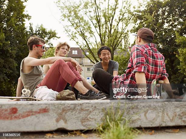 skater - boy sitting stock pictures, royalty-free photos & images