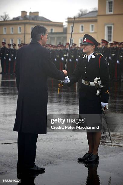 Senior Under Officer Sarah Hunter-Choat receives the Sword of Honour, awarded to the best overall officer cadet, from Defence Secretary Philip...