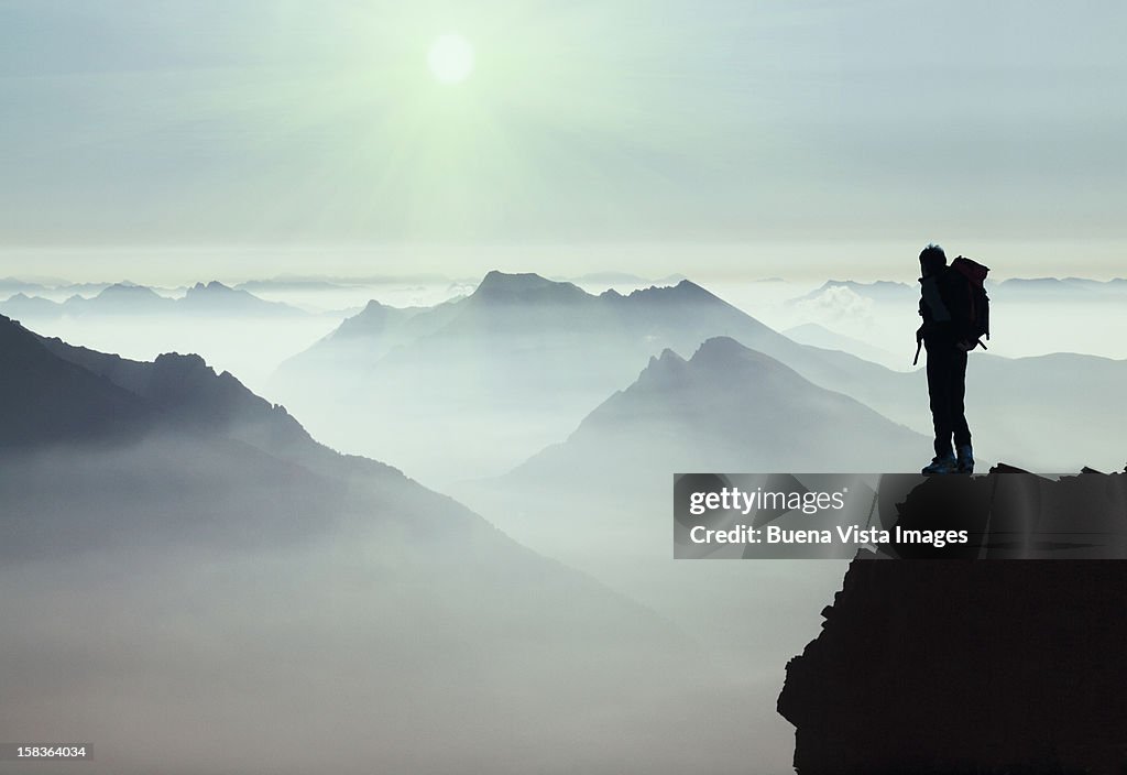 Climber watching a mountain ridge