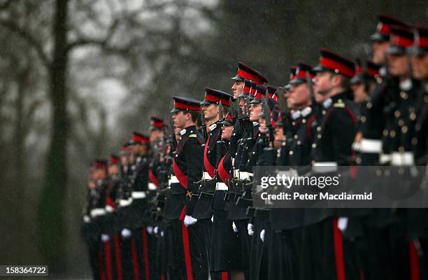 Cadets take part in the Sovereign's Parade in heavy rain at the Royal Military Academy at Sandhurst on December 14, 2012 in England. The parade marks...