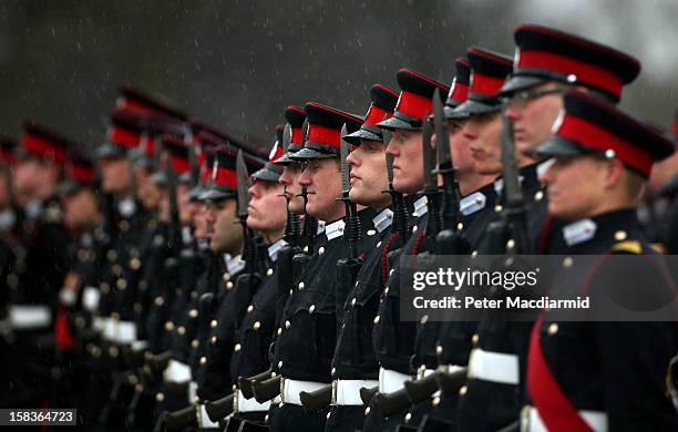 Cadets take part in the Sovereign's Parade in heavy rain at the Royal Military Academy at Sandhurst on December 14, 2012 in England. The parade marks...