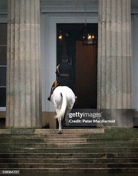 An Academy Adjutant rides his horse Winston up the steps into the Old College after completion of the Sovereign's Parade at the Royal Military...