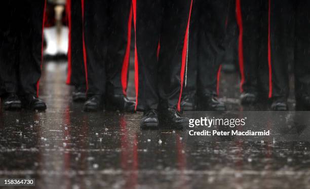 Cadets take part in the Sovereign's Parade in heavy rain at the Royal Military Academy at Sandhurst on December 14, 2012 in England. The parade marks...