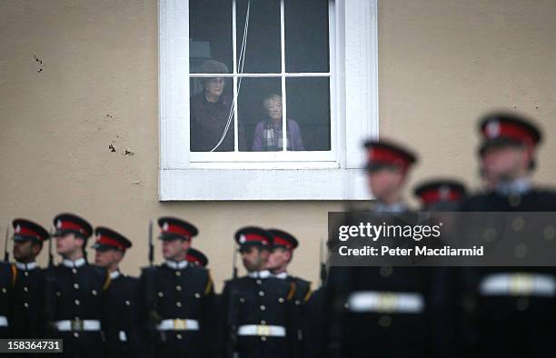 People watch the Sovereign's Parade from a window in the Old College at the Royal Military Academy at Sandhurst on December 14, 2012 in England. The...