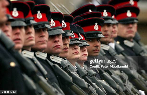 Cadets take part in the Sovereign's Parade in heavy rain at the Royal Military Academy at Sandhurst on December 14, 2012 in England. The parade marks...