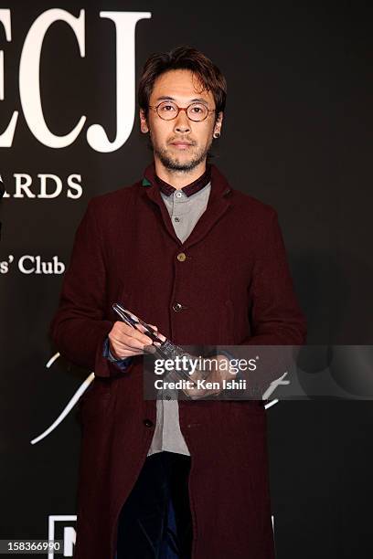 Designer Jun Takahashi of Undercover receives the Designer of the Year award during the 54th Fashion Editors Club of Japan Awards at Mercedes-Benz...