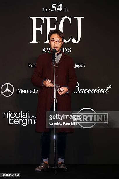 Designer Jun Takahashi of Undercover receives the Designer of the Year award during the 54th Fashion Editors Club of Japan Awards at Mercedes-Benz...