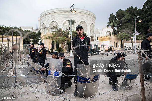 Soldiers stand guard in front of the presidential palace on December 14, 2012 in Cairo, Egypt. Opponents and supporters of Egyptian President Mohamed...