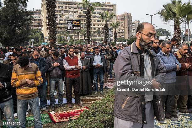 Supporters of Egyptian President Mohamed Morsi and members of the Muslim Brotherhood pray during Friday prayers and a rally on December 14, 2012 in...