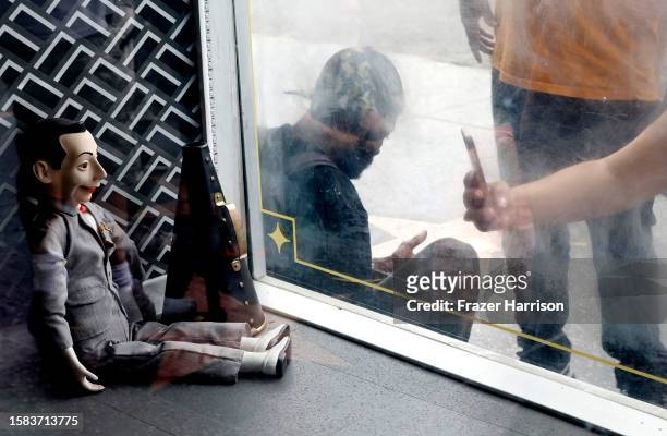 Puppet of Pee Wee Hermen sits in a store window near the Walk of Fame star for Pee-wee Herman as Hollywood Remembers Actor Paul Reubens on July 31,...