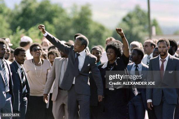 Anti-apartheid leader and African National Congress member Nelson Mandela and his wife anti-apartheid campaigner Winnie raise fists upon Mandela's...