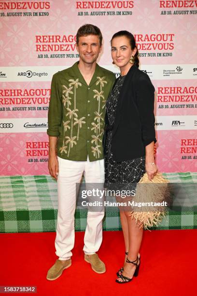 Thomas Müller and his wife Lisa Müller attend the Premiere for "Rehragout Rendezvous" at Mathaeser Filmpalast on July 31, 2023 in Munich, Germany.