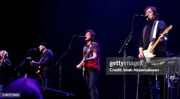 Musicians John Cowan, Patrick Simmons, Tom Johnston, and John McFee of The Doobie Brothers perform at the 95.5 KLOS Christmas Show held at Nokia...