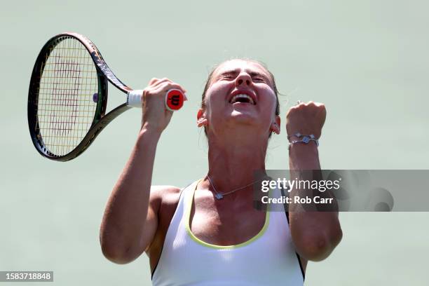 Marta Kostyuk of Ukraine celebrates winning match point against Bianca Andreescu of Canada during Day 3 of the Mubadala Citi DC Open at Rock Creek...