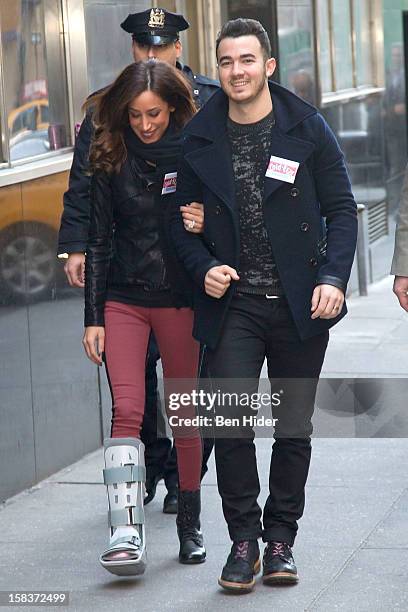 Kevin Jonas And Danielle Jonas attend City Harvest Holiday Season Food Drive at FDNY Station - Lexington & 3rd on December 14, 2012 in New York City.