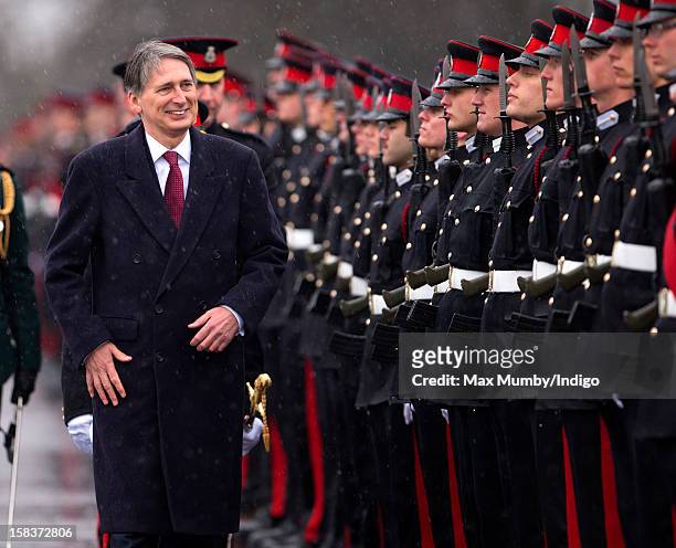 Secretary of State for Defence Philip Hammond inspects the Officer Cadets as he represents Queen Elizabeth II during the Sovereign's Parade at the...