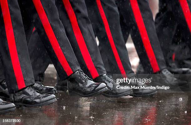 Officer Cadets take part in the Sovereign's Parade during heavy rain at the Royal Military Academy Sandhurst on December 14, 2012 in Sandhurst,...