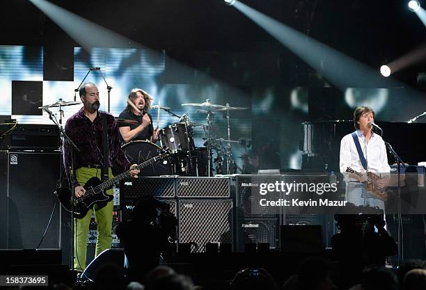 Krist Novoselic, Dave Grohl and Sir Paul McCartney perform at "12-12-12" a concert benefiting The Robin Hood Relief Fund to aid the victims of...