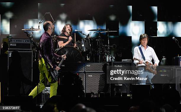 Krist Novoselic, Dave Grohl and Sir Paul McCartney perform at "12-12-12" a concert benefiting The Robin Hood Relief Fund to aid the victims of...