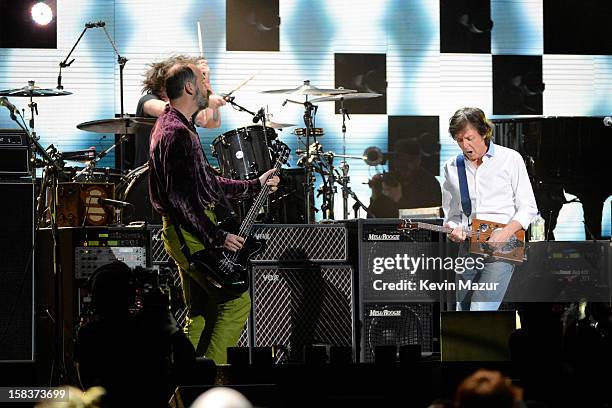 Krist Novoselic, Dave Grohl and Sir Paul McCartney perform at "12-12-12" a concert benefiting The Robin Hood Relief Fund to aid the victims of...