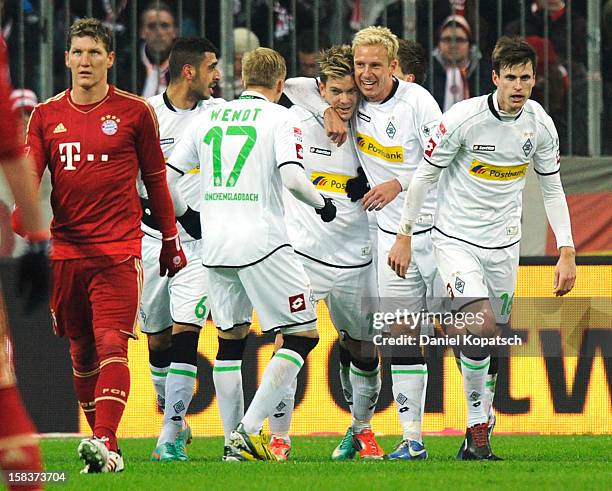 Thorben Marx of Moenchengladbach celebrates his team's first goal with team mates during the Bundesliga match between FC Bayern Muenchen and VfL...