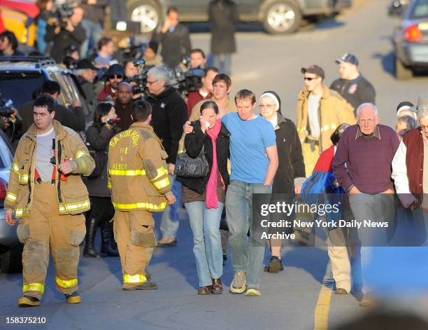 Robbie and Alyssa Parker outside firehouse at Sandy Hook Elementary School in Newtown, CT. The Parker's daughter, Emilie, was one of the 20 children...