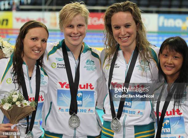 Australian women's relay team Sarah Katsoulis, Angie Bainbridge, Mariele Guehrer and Rachel Goh poses with their silver medal from the 4x100m Medely...