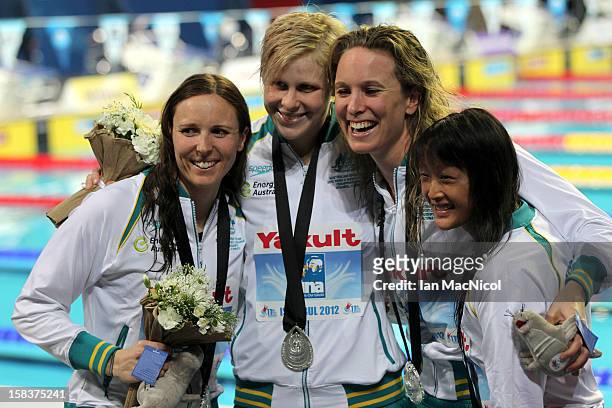 Australian women's relay team Sarah Katsoulis, Angie Bainbridge, Mariele Guehrer and Rachel Goh poses with their silver medal from the 4x100m Medely...