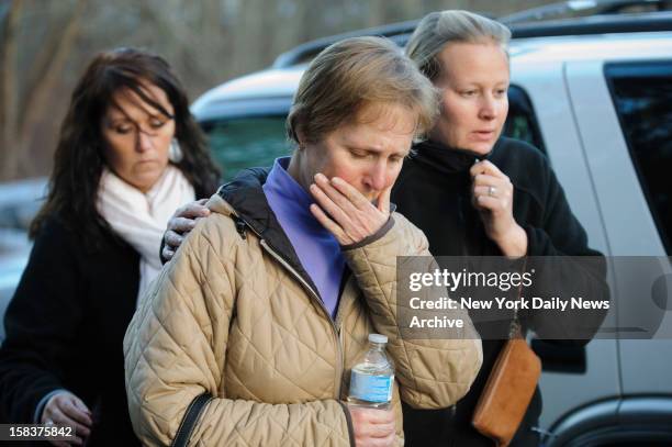 School nurse Sarah Cox speaks outside Sandy Hook Elementary School in Newtown, CT. A gunman opened fire inside school killing 27 people, including 20...