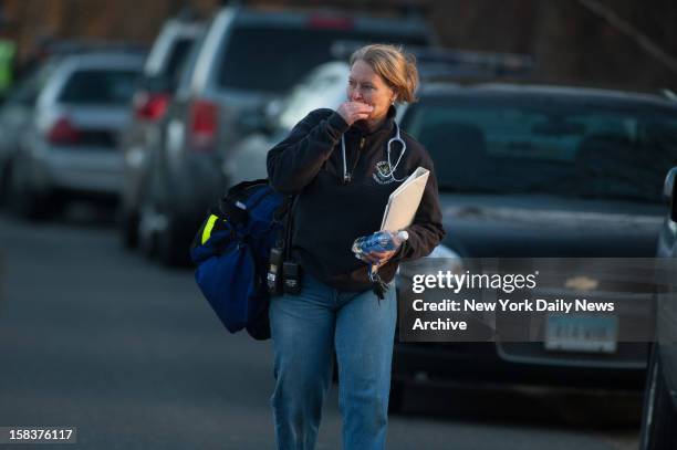 Distraught woman outside firehouse near Sandy Hook Elementary School in Newtown, CT. The firehouse became rally point after a gunman opened fire...