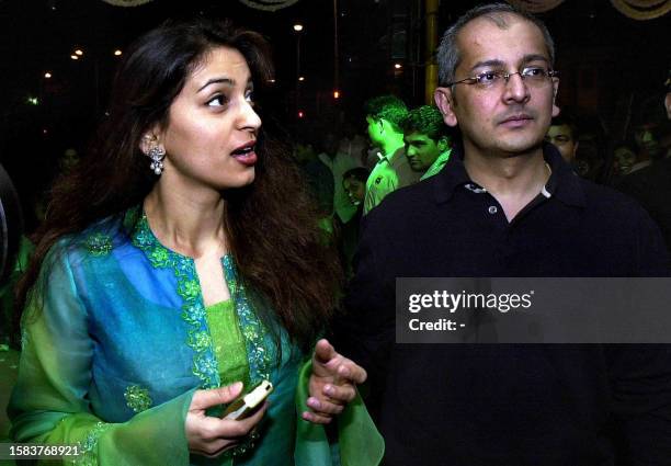 Bollywood actress Juhi Chawla and her her husband Jay Meheta arrive at the premiere of the movie 'Kaante' in Bombay, 19 December 2002. Director...