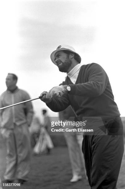 During the Bing Crosby National Pro-Amateur golf tournament, American actor James Garner tees off from the 17th hole on the course at Cypress Point,...