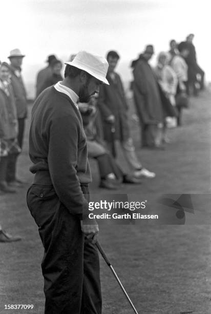 During the Bing Crosby National Pro-Amateur golf tournament, American actor James Garner stands on the course near the 17th hole at Cypress Point,...